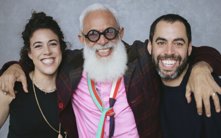 Hari Salem poses with his daughter Tassie and son Lucan in a smiling studio portrait.